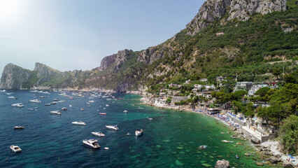 Fototapeta premium Cinematic drone view of Marina del Cantone beach and Mediterranean coastline