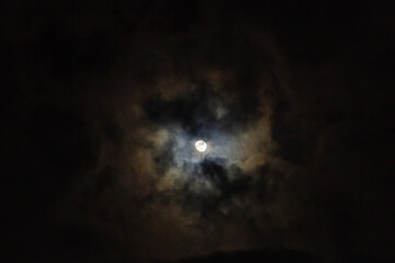 Fototapeta premium Full moon and clouds in the night sky. Night sky background.