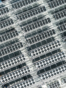 Aerial view of the EU North Riga LV DC1 data center roof, featuring rows of industrial cooling fans and ventilation infrastructure in Riga, Latvia.