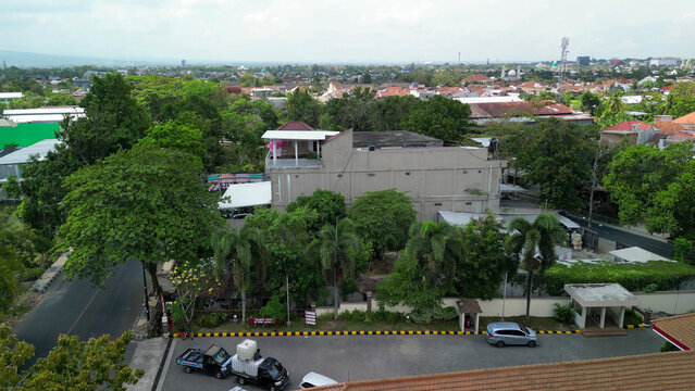 Drone perspective of Mataram showing cityscape, buildings, and surrounding tropical scenery