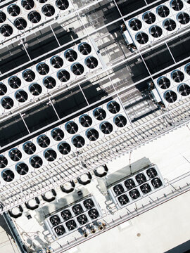 Aerial view of the EU North Riga LV DC1 data center roof featuring rows of industrial cooling fans and ventilation systems in Riga, Latvia.