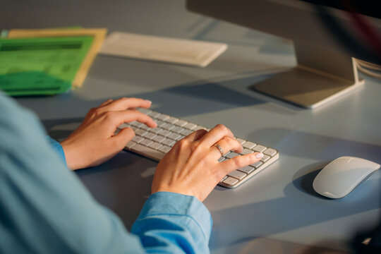A woman uses a computer in the office