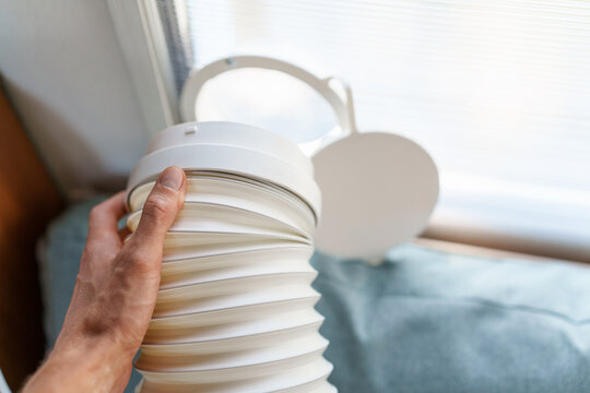 Installing a portable air conditioner exhaust hose into a custom polycarbonate window kit