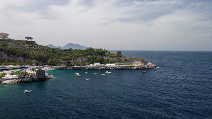 Fototapeta premium Drone aerial view of Marina di Puolo bay and turquoise sea waters