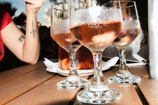 Flash-Lit Sangria Glasses at an Outdoor Gathering