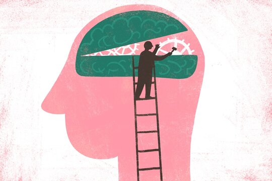 Illustrations of a human head with a small figure inside fixing brain