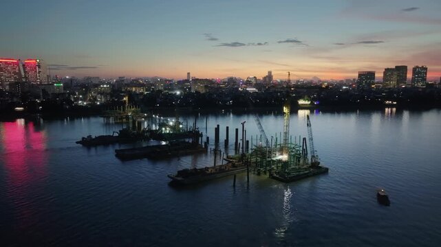 Tran Hung Dao Bridge construction on Red River, Hanoi at dusk