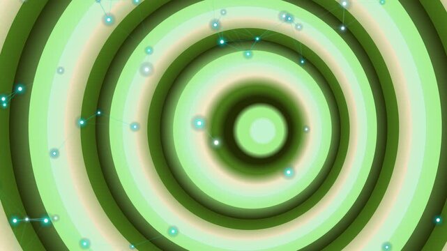 Abstract green concentric circles pattern with glowing light particles