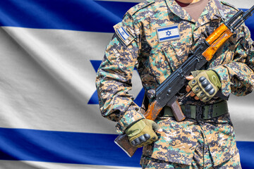 Fototapeta premium Israel flag with soldier holding assault rifle