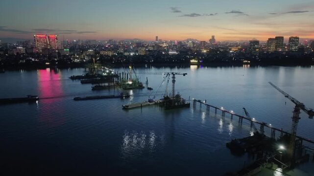 Tran Hung Dao Bridge Construction on Red River, Hanoi at Dusk