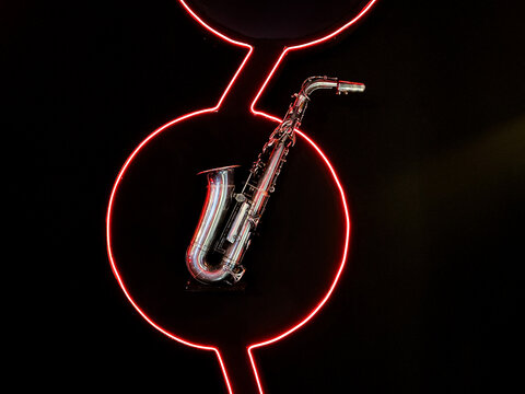 Retro style saxophone on dark background