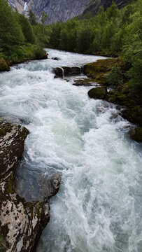 Bovra River waterfall cascading into the Otta River in Lom, Norway