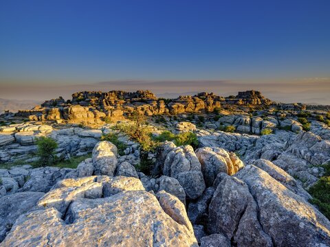 Limestone rock formations at sunset, El Torcal nature reserve, Torcal de Antequera, Malaga province, Andalusia, Spain