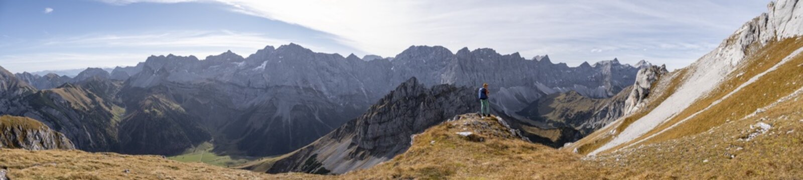 Alpine panorama, hiker on hiking trail, hiking to Gamsjoch, behind Dreizinkenspitze and Laliederer Wand, eastern Karwendel, Tyrol, Austria