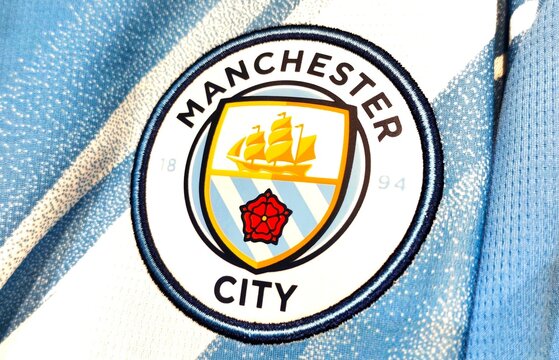 Photo of the embroidered emblem of Manchester City football club on the 2025-2026 home kit. Manchester City is a professional football club based in Manchester, England.