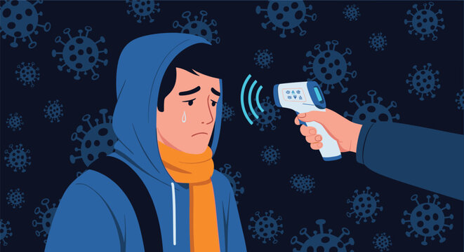Medical professional's hand using a non-contact infrared thermometer to take the temperature of a person's forehead in a dark setting.