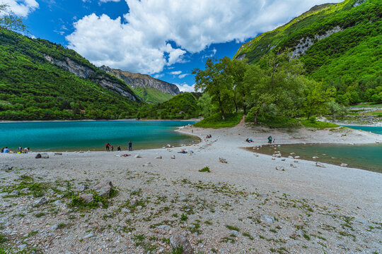 The view of Lake Tenno, a splendid alpine lake nestled between mountains and woods, near Lake Garda, near the town of Tenno, Trentino, Italy - May 2026
