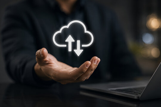Businessman presenting cloud computing technology with upload and download symbols, representing secure data storage, cloud infrastructure, file synchronization.