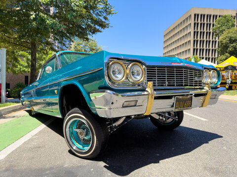Turquoise Chevrolet Impala Lowrider With Raised Front End