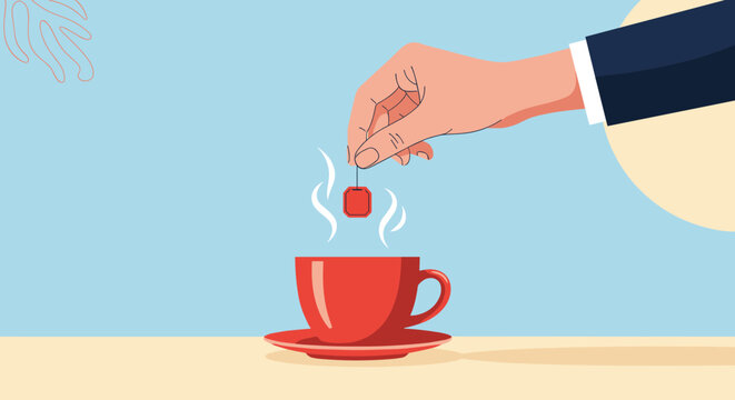 Hand in a business suit dips a red tea bag into a matching red ceramic cup of steaming hot tea for a quick office break or relaxation.