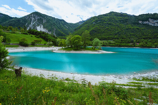 The view of Lake Tenno, a splendid alpine lake nestled between mountains and woods, near Lake Garda, near the town of Tenno, Trentino, Italy - May 2026