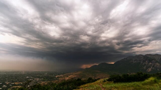 Wildfire smoke and rain blowing in with thunderstorm through Utah Valley in timelapse heading towards Timpanogos Mountain.