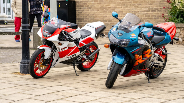 Seahouses, Northumberland, UK - June 14 2026. A classic Yamaha TZR250 two-stroke and a Honda Fireblade stand parked in Seahouses, showcasing two iconic motorcycles 