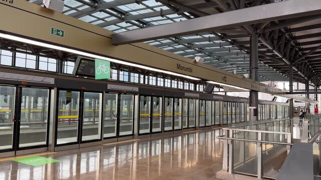 Platform view of Morumbi Station on São Paulo's Line 17 Gold featuring platform screen doors, modern architecture, and safe urban public transportation infrastructure