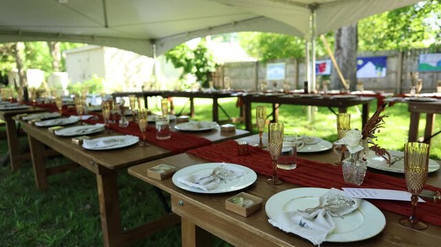 Outdoor table setup under canopy for garden celebration