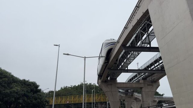 Elevated monorail on São Paulo's Line 17 Gold traveling on a concrete guideway, representing innovative urban transportation and sustainable mobility.