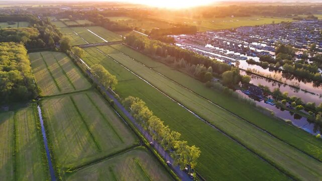 Aerial drone view the harbour of Scheendijk Loosdrechtse Plassen, a floating village in the Netherlands at sunset. High quality 4k footage