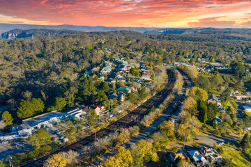 Obraz premium Aerial photograph of the regional train line running through the busy tourist town of Katoomba in the Blue Mountains in New South Wales, Australia