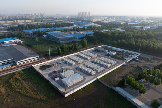 Aerial view of an industrial park energy storage power station with battery arrays and surrounding facilities