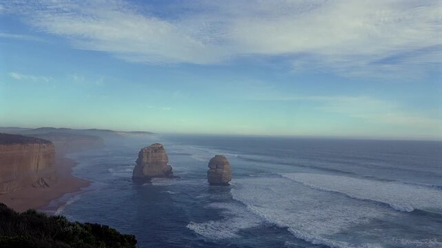 Gog and Magog Rock Formations at the Iconic Twelve Apostles stand tall against the vast ocean horizon on the Great Ocean Road in Australia 