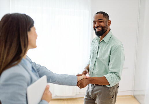 Portrait of a young black man  or a businessman, or a business meeting, or consultation  shaking hands