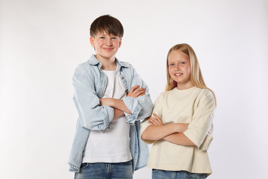 Portrait of brother and sister on white background
