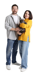 Fototapeta premium Couple with their cute cat on white background