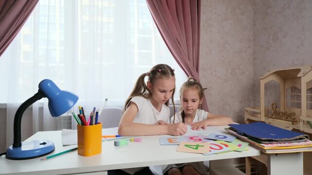 Realistic Home Learning Scene Showing Mistake Correction and Emotional Peer Support Between Children