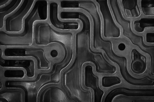 Close-up of a 3D-printed industrial metal component with complex matrix mesh structure. tech background, industrial background, technology background, manufacturing