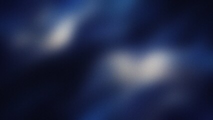 Abstract blue and white bokeh lights during nighttime with shallow depth of field creating a dreamy atmosphere © CreativeArtnest