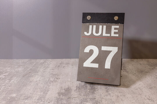 Jule 27 Calendar Date on Desk Monthly Planning, Deadline and Schedule Concept