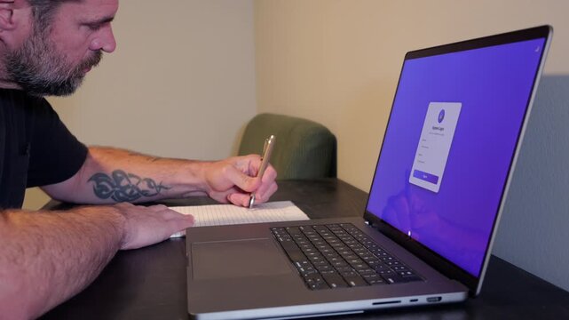 Male user faces an access denied screen on a laptop after writing down and reusing insecure passwords on a paper notepad, illustrating a data breach