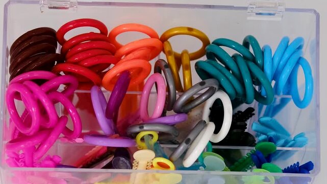 Orthodontic elastics organizer with colorful dental ligatures and separators for braces treatment