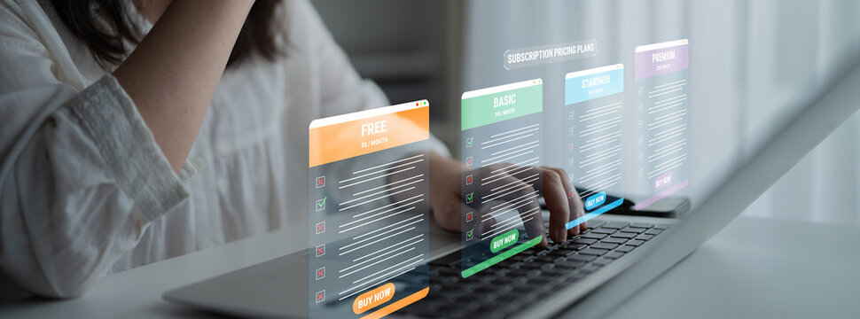Modern digital interface showcasing subscription plans on a laptop, featuring vibrant colored options with clear pricing tiers and engaging user experience. Glyphic.