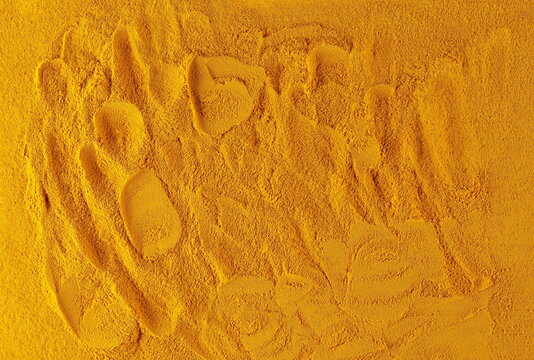 Turmeric powder background and texture