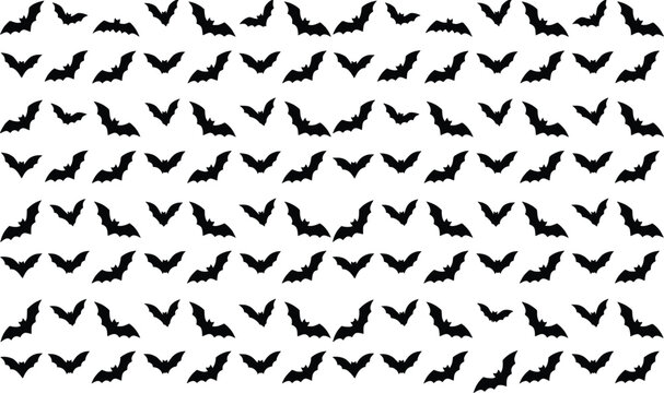 Seamless pattern of black bats in flight against a white background halloween themed design