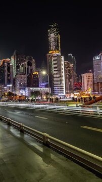 Chongqing cyberpunk city skyline on the Qiansimen Bridge in vertical
