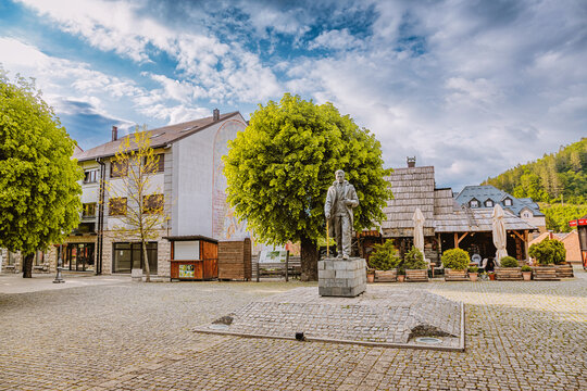 KOLASIN, MONTENEGRO - 21 May 2026: Monument to Veljko Vlahovic on the central town square surrounded by local architecture and public space