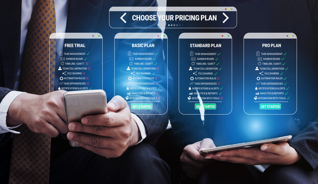 Business professionals selecting pricing plans on mobile devices with apps interface showcasing free trial and subscription options for services Quark.