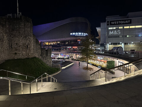 December 8, 2022 - SOUTHAMPTON, ENGLAND: View of central Southampton West Quay shopping centre and old town wall at night in Southampton, Hampshire in the UK